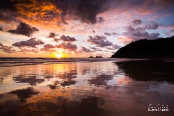 A beautiful sunrise reflecting off the wet sand at Broken Head Beach, Broken Head, North Coast, New South Wales, Australia - landscape photographer