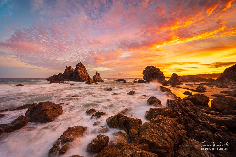 A spectacular sunset over Camel Rock and crashing waves. Lake Wallaga, Sapphire Coast, New South Wales, Australia - landscape photography